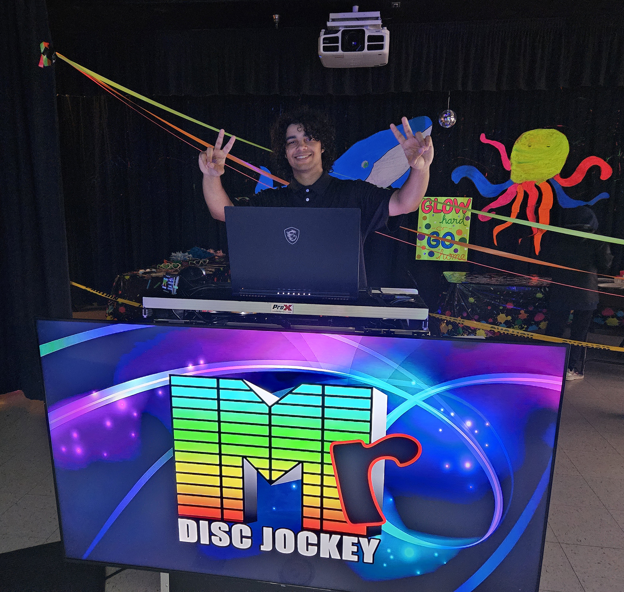 DJ Ace at the Mr Disc Jockey DJ Booth Glow Party Theme